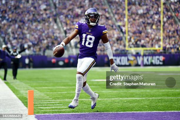 Justin Jefferson of the Minnesota Vikings scores a touchdown during the first quarter in the game against the Green Bay Packers at U.S. Bank Stadium...