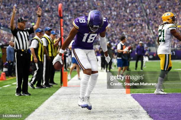 Justin Jefferson of the Minnesota Vikings celebrates after scoring a touchdown during the first quarter in the game against the Green Bay Packers at...