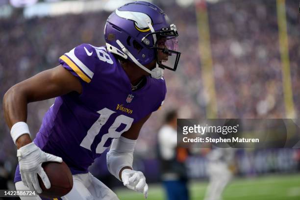Justin Jefferson of the Minnesota Vikings celebrates after scoring a touchdown during the first quarter in the game against the Green Bay Packers at...