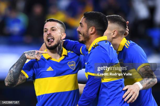 Darío Benedetto of Boca Juniors celebrates with teammates after scoring the first goal of his team during a match between Boca Juniors and River...