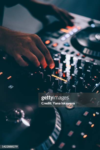 american dj working with sound, spinning turntable records at a night club party - concert speakers stock pictures, royalty-free photos & images