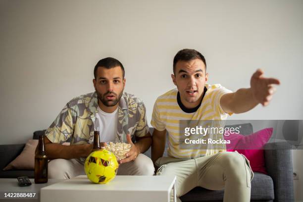 friends watching tv, sport match together - championship round two stock pictures, royalty-free photos & images