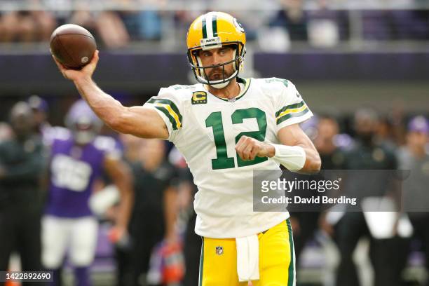 Aaron Rodgers of the Green Bay Packers throws a pass during the second quarter in the game against the Minnesota Vikings at U.S. Bank Stadium on...