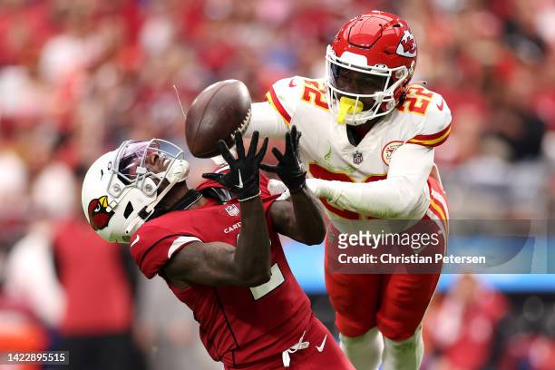 Wide receiver Marquise Brown of the Arizona Cardinals catches the ball as safety Juan Thornhill of the Kansas City Chiefs defends during the game at...