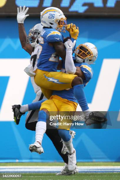 Cornerback Asante Samuel Jr. #26 of the Los Angeles Chargers intercepts a pass over cornerback Bryce Callahan of the Los Angeles Chargers and wide...