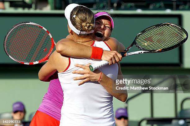 Maria Kirilenko and Nadia Petrova of Russia celebrate match point against Sara Errani Roberta Vinci of Italy during the doubles final of the Sony...