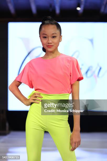 Model walks the runway for YS Clothier during The Fashion Life Tour presents New York Fashion Week hosted by Kiara Belen on September 10, 2022 in New...