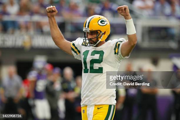 Aaron Rodgers of the Green Bay Packers celebrates a touchdown during the third quarter in the game against the Minnesota Vikings at U.S. Bank Stadium...