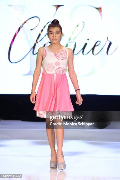 Model walks the runway for YS Clothier during The Fashion Life Tour presents New York Fashion Week hosted by Kiara Belen on September 10, 2022 in New...