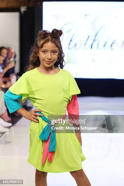 Model walks the runway for YS Clothier during The Fashion Life Tour presents New York Fashion Week hosted by Kiara Belen on September 10, 2022 in New...