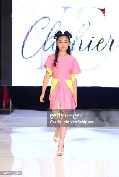 Model walks the runway for YS Clothier during The Fashion Life Tour presents New York Fashion Week hosted by Kiara Belen on September 10, 2022 in New...
