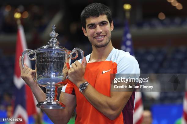Carlos Alcaraz of Spain celebrates with the championship trophy after defeating Casper Ruud of Norway during their Men’s Singles Final match on Day...