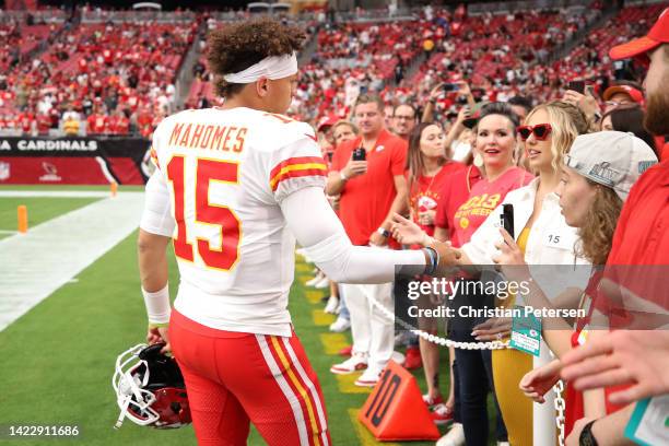 Quarterback Patrick Mahomes of the Kansas City Chiefs greets his wife Brittany Matthews before the game against the Arizona Cardinals at State Farm...