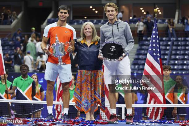 Carlos Alcaraz of Spain, USTA Chief Executive Stacey Allaster, and Casper Ruud of Norway pose with their trophies after their Men’s Singles Final...