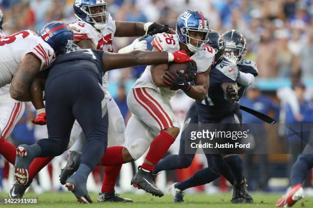 Running back Saquon Barkley of the New York Giants runs the ball during the second half against the Tennessee Titans at Nissan Stadium on September...