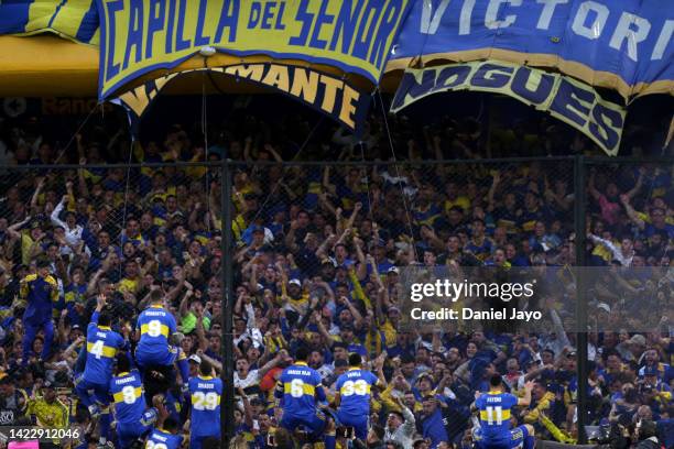 Darío Benedetto of Boca Juniors celebrates with fans after scoring the first goal of his team during a match between Boca Juniors and River Plate as...