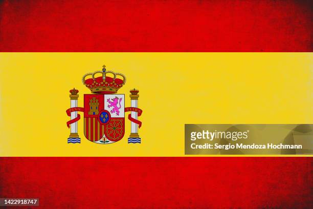 flag of spain with a grunge texture - spanische flagge stock-fotos und bilder