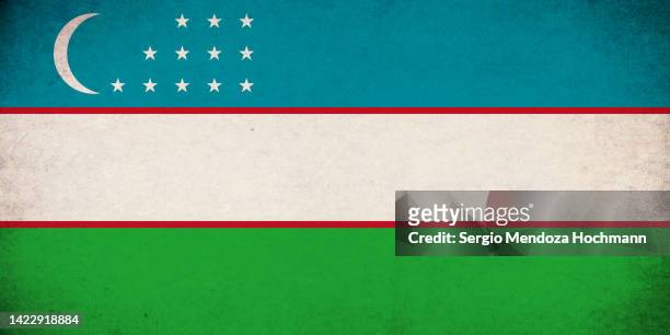 flag of uzbekistan with a grunge texture - uzbekistan stock-fotos und bilder