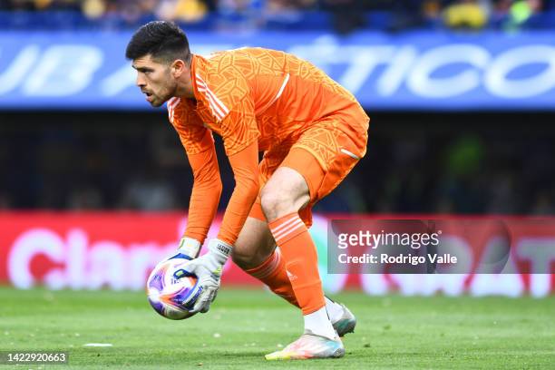 Agustín Rossi of Boca Juniors handles the ball during a match between Boca Juniors and River Plate as part of Liga Profesional 2022 at Estadio...