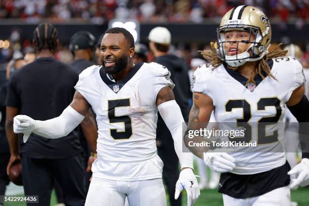 Jarvis Landry and Tyrann Mathieu of the New Orleans Saints react on the sideline during the fourth quarter against the Atlanta Falcons at...
