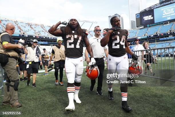 Kareem Hunt of the Cleveland Browns and Nick Chubb leave the field after defeating the Carolina Panthers at Bank of America Stadium on September 11,...