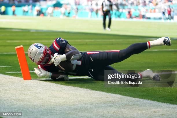 Ty Montgomery of the New England Patriots scores a touchdown during the third quarter in the game against the Miami Dolphins at Hard Rock Stadium on...