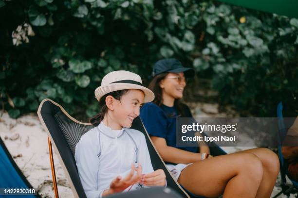 young girl having fun at beach campsite - eurasian ethnicity stock pictures, royalty-free photos & images