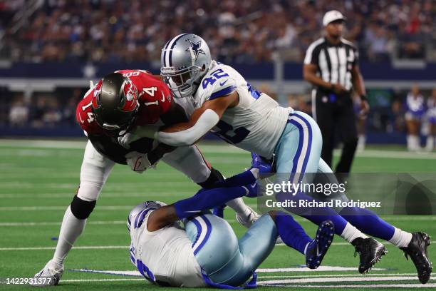 Anthony Barr of the Dallas Cowboys tackles Chris Godwin of the Tampa Bay Buccaneers during the first half at AT&T Stadium on September 11, 2022 in...