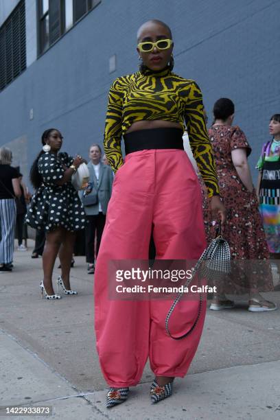 Amazingadee is seen wearing a top from Ganni and pants from Farfetch on September 10, 2022 in New York City.