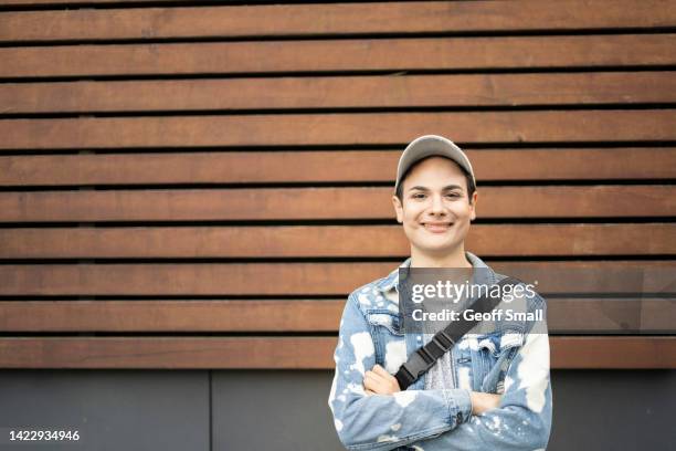 portrait of a smiling person - non binary stereotypes stock pictures, royalty-free photos & images