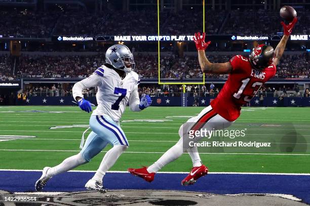 Mike Evans of the Tampa Bay Buccaneers scores a touchdown ahead of Trevon Diggs of the Dallas Cowboys during the second half at AT&T Stadium on...