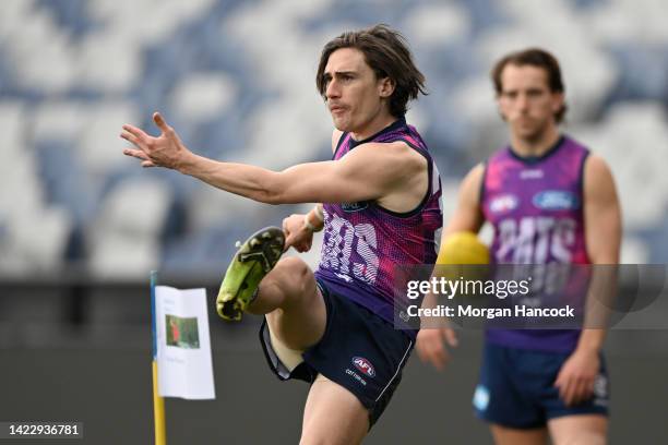 Gryan Miers of the Cats kicks during a Geelong Cats AFL training session at GMHBA Stadium on September 12, 2022 in Geelong, Australia.