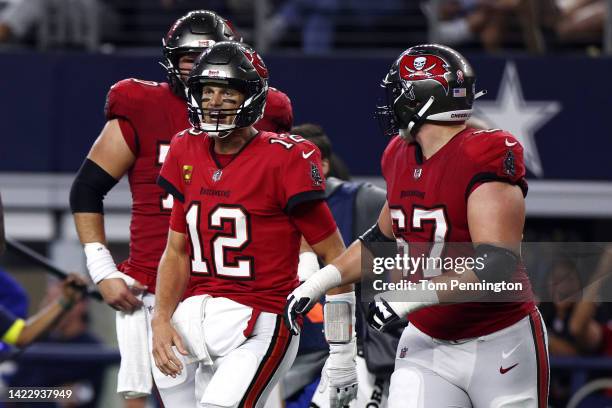 Tom Brady of the Tampa Bay Buccaneers celebrates after throwing a touchdown pass to Mike Evans during the second half against the Dallas Cowboys at...