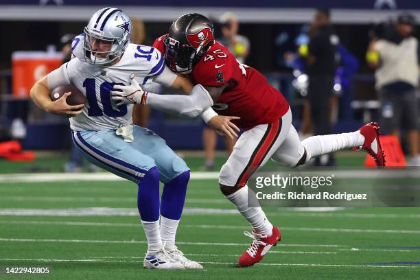 Devin White of the Tampa Bay Buccaneers tackles Cooper Rush of the Dallas Cowboys during the second half at AT&T Stadium on September 11, 2022 in...