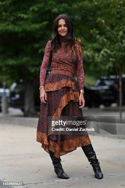 Katie Holmes is seen wearing a brown Ulla Johnson dress outside the Ulla Johnson show during New York Fashion Week S/S 2023 on September 11, 2022 in...