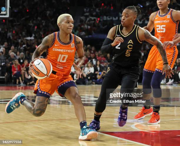 Courtney Williams of the Connecticut Sun drives against Riquna Williams of the Las Vegas Aces in the second quarter of Game One of the 2022 WNBA...