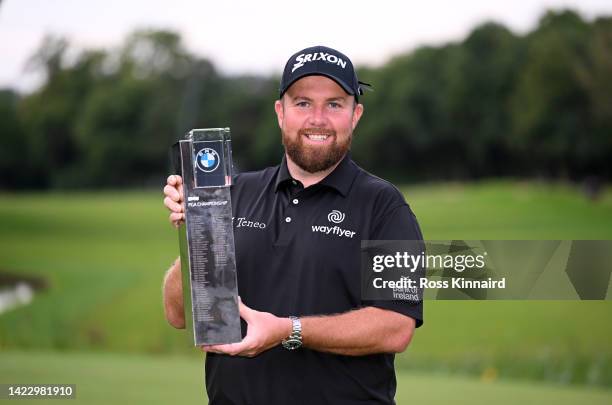 Shane Lowry of Ireland celebrates with the winners trophy on the 18th green after the final round of the BMW PGA Championship at Wentworth Golf Club...