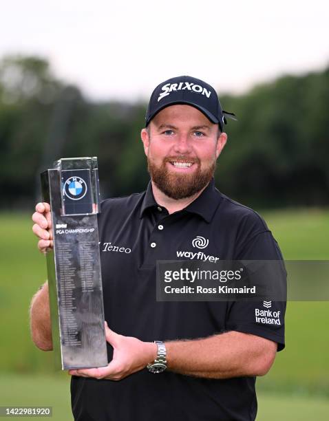 Shane Lowry of Ireland celebrates with the winners trophy on the 18th green after the final round of the BMW PGA Championship at Wentworth Golf Club...
