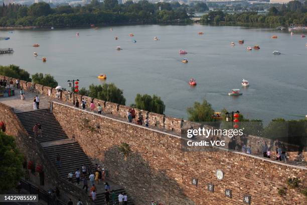 Tourists visit Ming Dynasty City Wall during the Mid-Autumn Festival holiday on September 11, 2022 in Nanjing, Jiangsu Province of China.