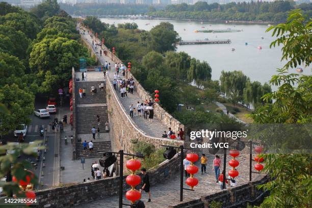 Tourists visit Ming Dynasty City Wall during the Mid-Autumn Festival holiday on September 11, 2022 in Nanjing, Jiangsu Province of China.