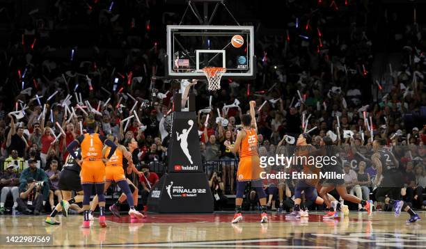 Fans wave glow batons as Alyssa Thomas of the Connecticut Sun shoots a free throw against the Las Vegas Aces in the third quarter of Game One of the...
