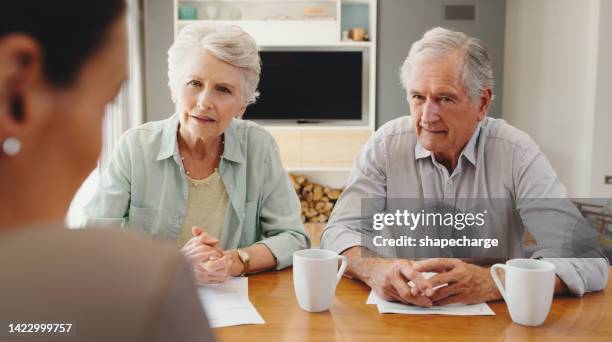 home insurance, mortgage and pension fund advice in will estate plan in retirement from legal advisor. elderly couple in finance or financial meeting with lawyer for paperwork, savings and investment - inheritance consulting stockfoto's en -beelden
