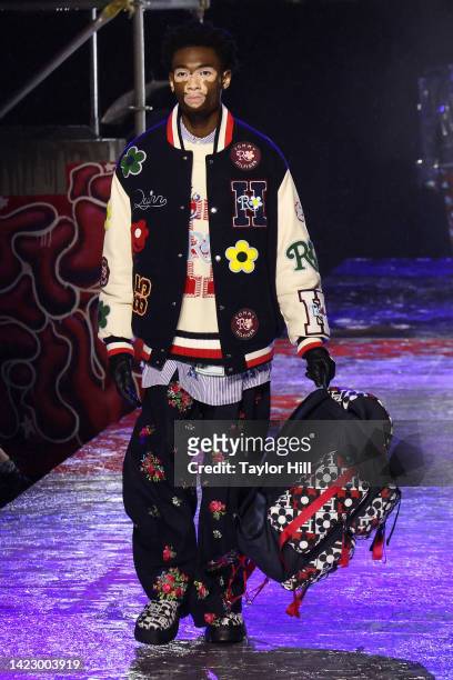 Yvesmark Chery walks the runway at the Tommy Factory New York Fall 2022 fashion show at Skyline Drive-In during New York Fashion Week on September...