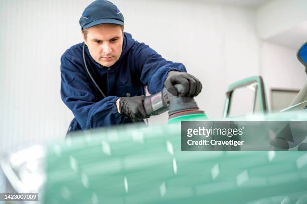 professional worker using orbital polisher in the auto repair color shop . he use the polishing equipment for make color brightness and reduce the scratch on color surface of car coat. - car detailing stock pictures, royalty-free photos & images