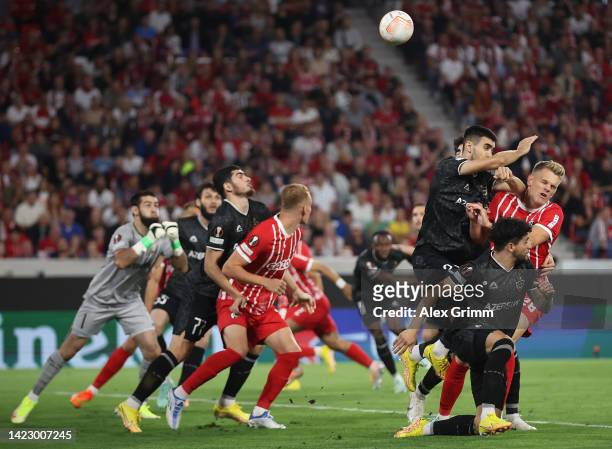 Toral Bayramov of Qarabag FK hits Matthias Ginter of Freiburg for a penalty during the UEFA Europa League group G match between Sport-Club Freiburg...