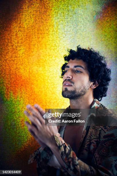 studio portrait of mid adult man praying - fallon stock pictures, royalty-free photos & images