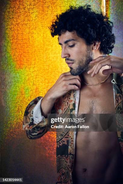 studio portrait of mid adult man wearing unbuttoned shirt - fallon stock pictures, royalty-free photos & images
