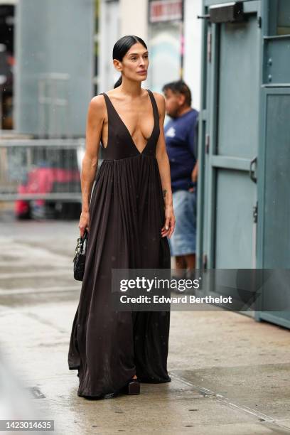 Guest wears a dark brown V-neck / tank-top long dress, a black shiny leather Lady D-Lite hand bag from Dior, black shiny varnished leather platform...