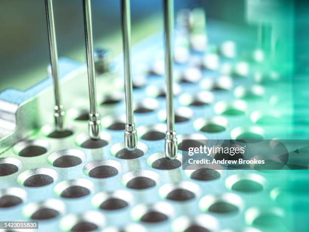 analysis of samples in micro plates using automation robotics - microplate stock pictures, royalty-free photos & images