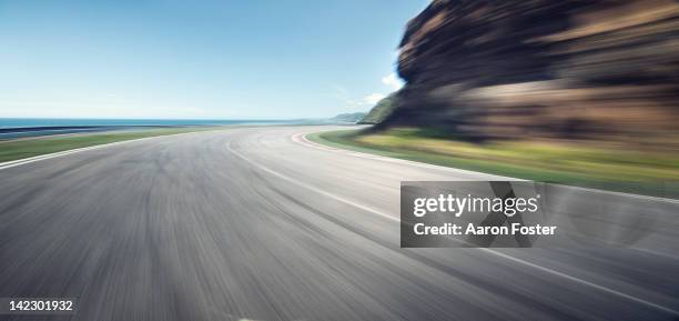 ocean cliff road - motion blur road stock pictures, royalty-free photos & images